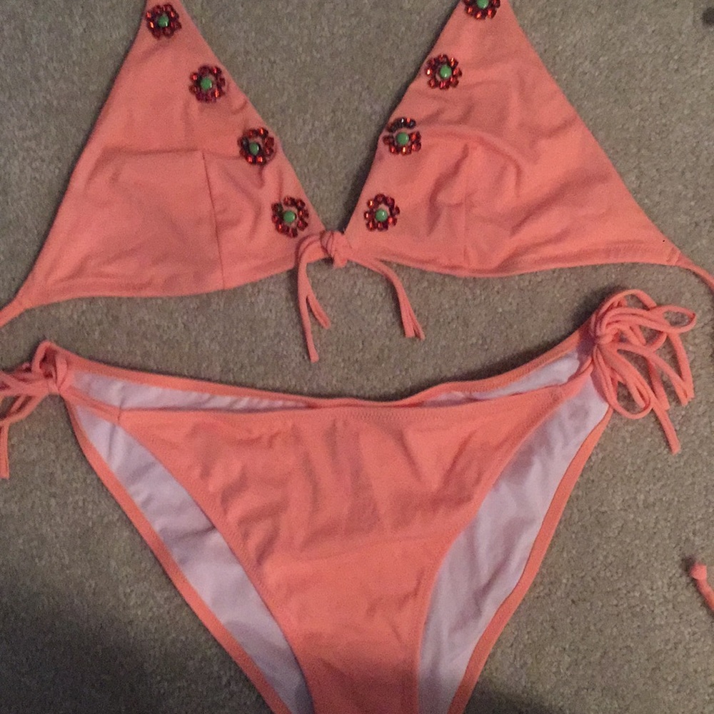 Victoria’s Secret swimsuit size large.